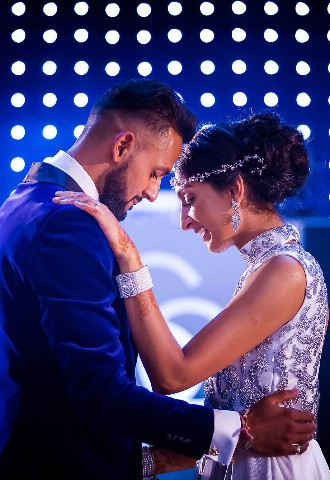 asian bride and groom take their first dance together