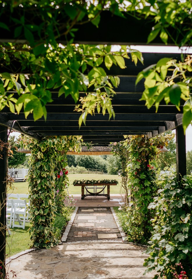 Outdoor wedding ceremony area at High House wedding venue in Essex