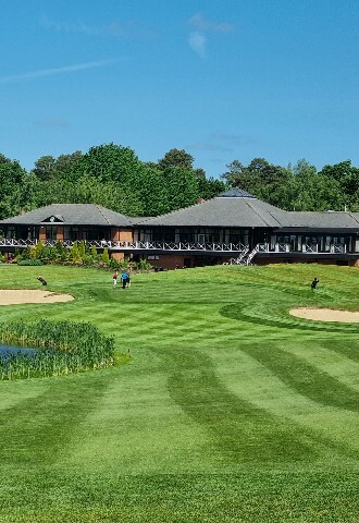 Clubhouse at Bearwood Lakes with view if 18th green and water feature