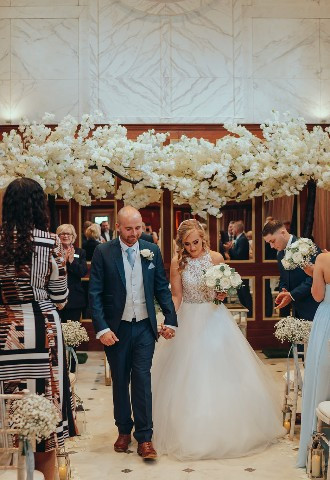 Bride and groom leaving their ceremony at Bourton Hall, Warwickshire
