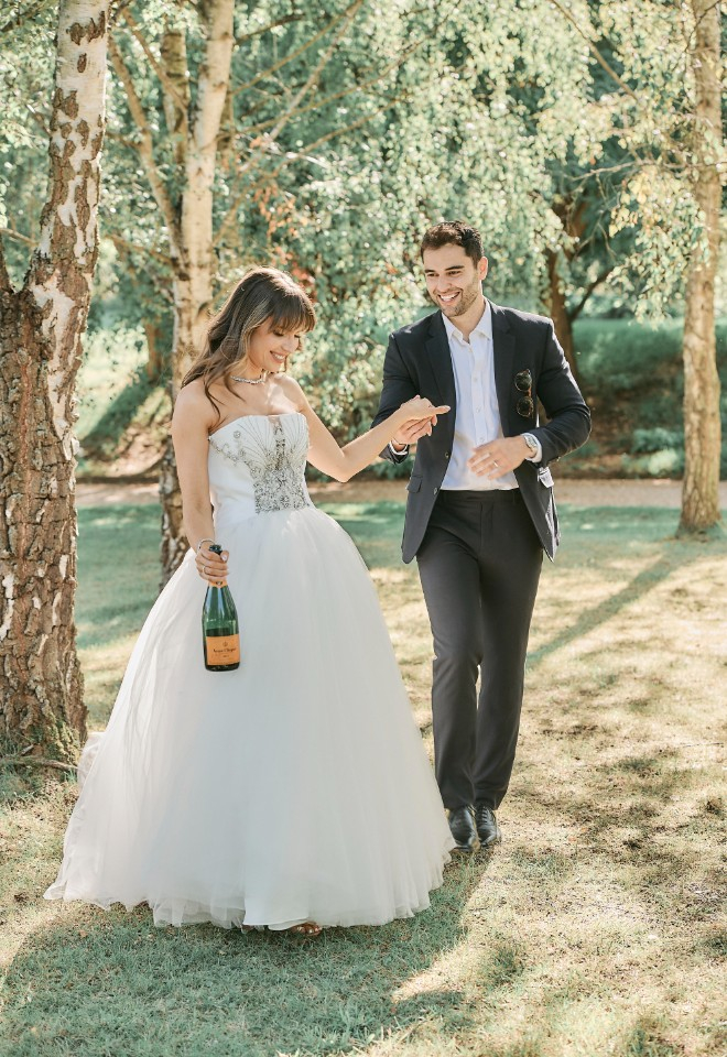 Bride and groom in shimmering ivory dress at Ballingdon Hall wedding by Stuart Wood