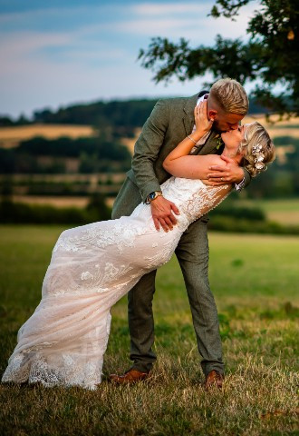 Bride gets dipped by her new husband 