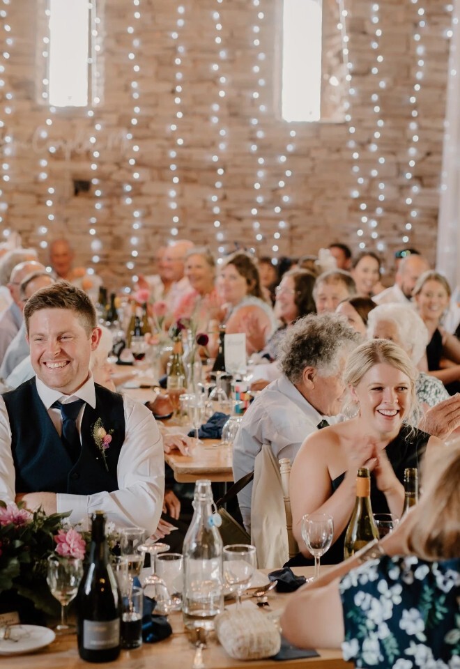 People enjoying a wedding breakfast at Dragons Gate