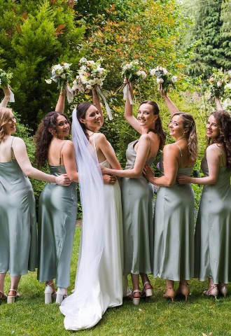 Bride and bridesmaids have posed wedding photo in the gardens of Egypt Mill