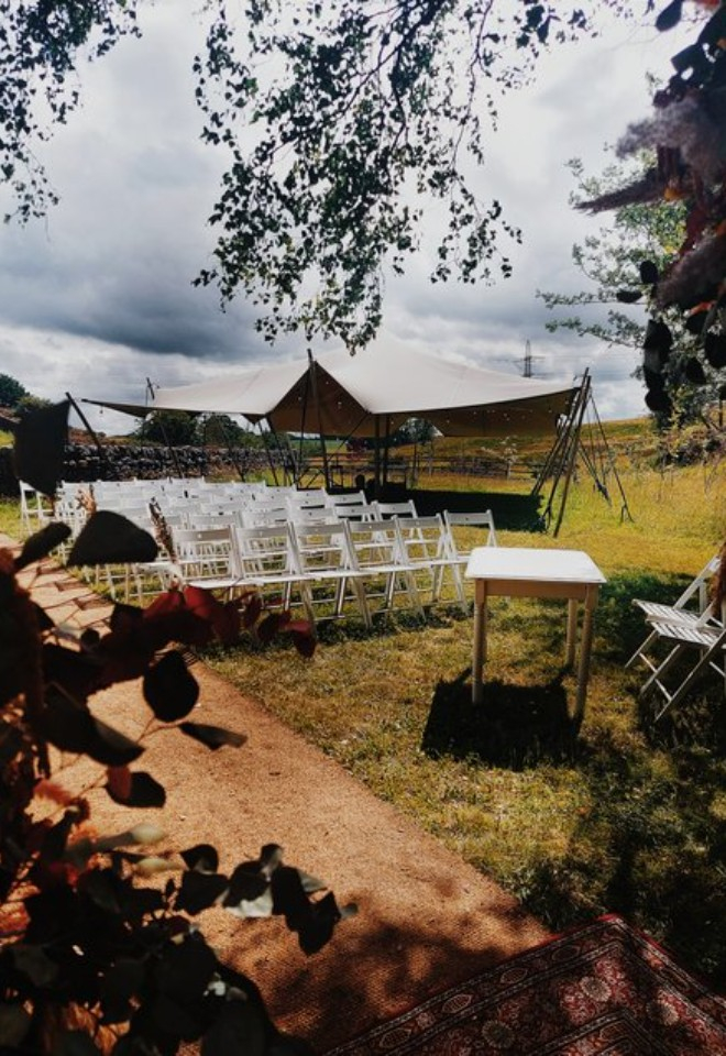 A view in the garden of the ceremony area and stretch tent at Folkerton Mill.
