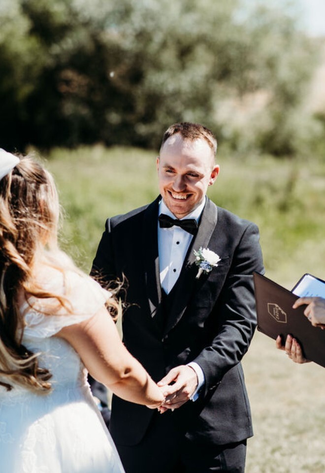 UK wedding celebrant leading outdoor wedding ceremony for bride and groom