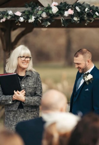 Ceremonies by Sally, leading a celebrant wedding, smiling with the groom