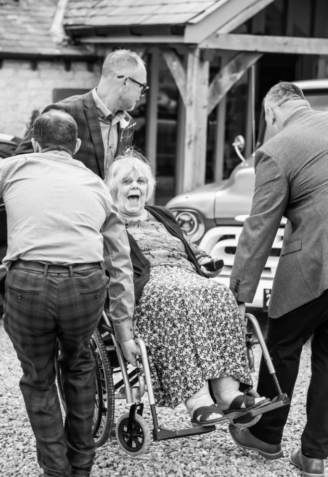Northampton wedding, giving granny a lift over the gravel
