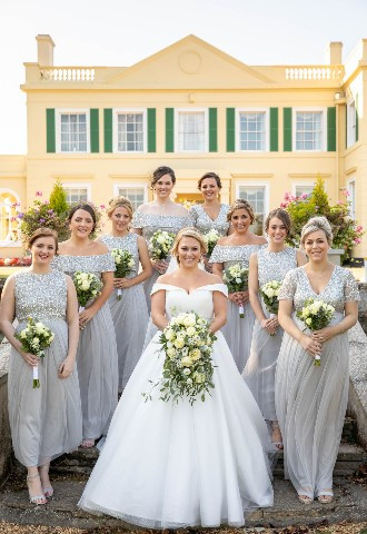 Bride and her Bridesmaids pose for wedding photography outside The Lawn, Rochford, Essex