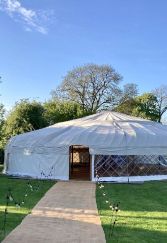 50ft event yurt with clear sides and opaque sides, views beyond