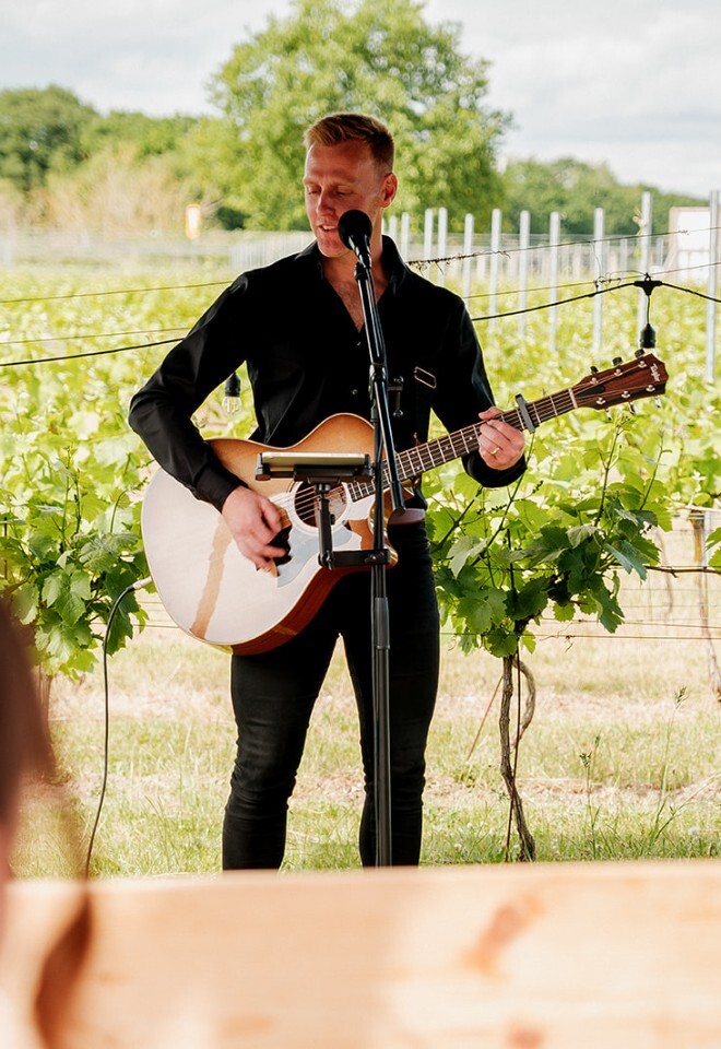 Guitarist performs at a drinks reception performed at a beautiful wedding venue in Essex