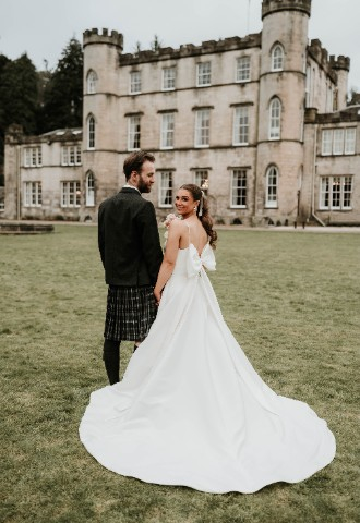 Wedding couple in the grounds at Melville Castle - a castle wedding venue near Edinburgh