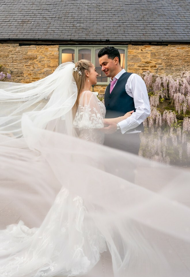bride and groom photos with veil