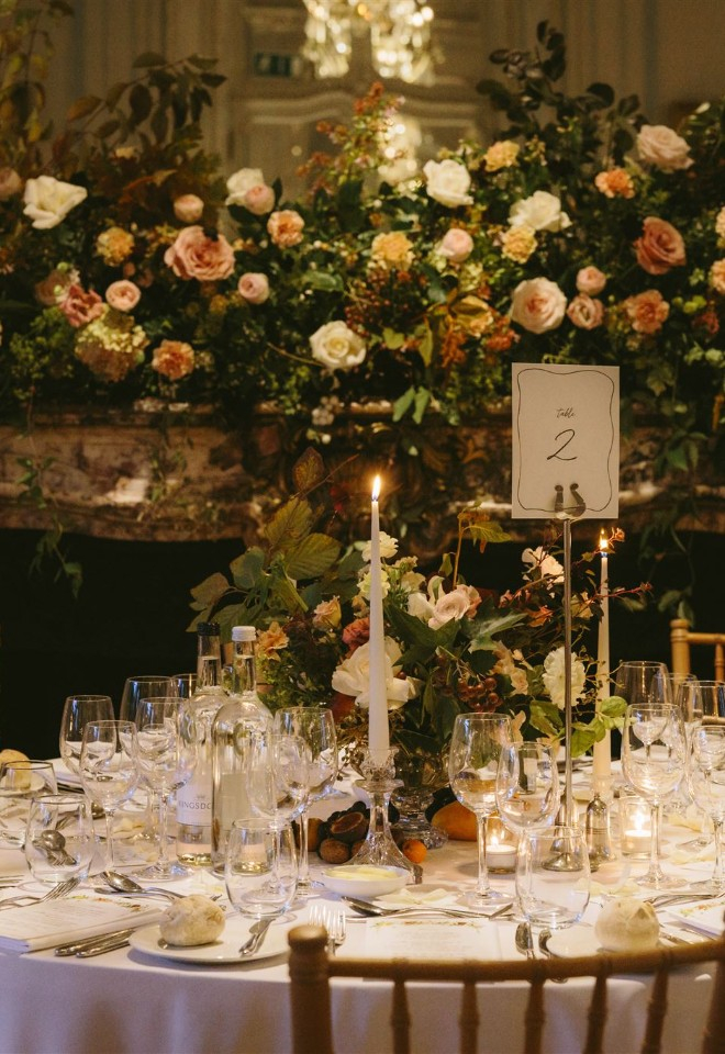 Mantelpiece installation and centrepiece of fruit and autumn flowers and foliage at the Savile Club Mayfair