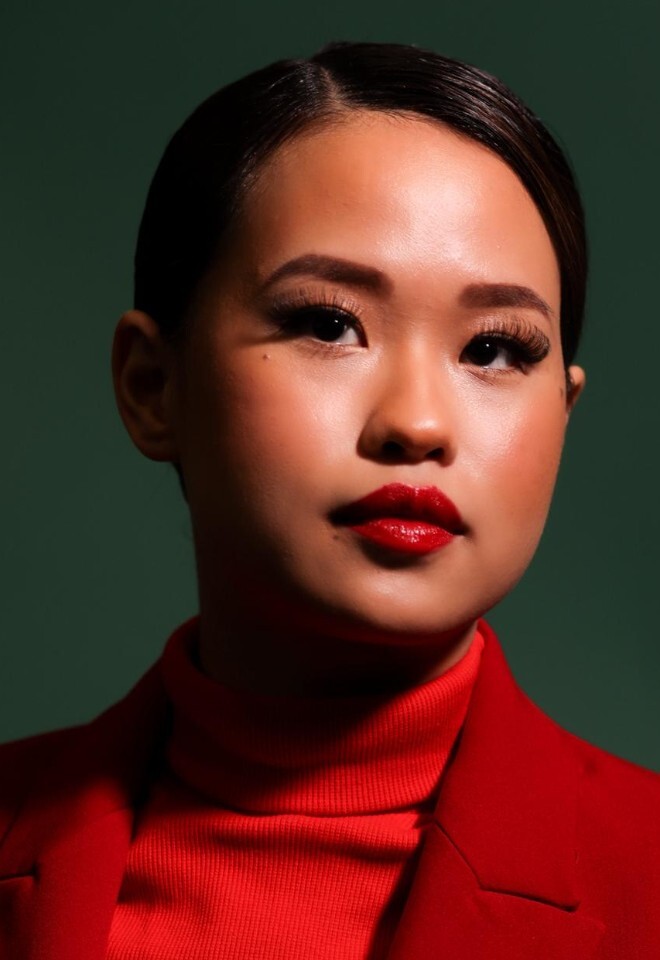 Soft glam editorial makeup with a bold red lip – radiant, flawless skin with a modern, polished finish.