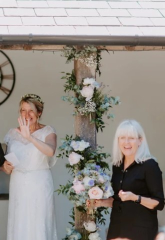 Ceremonies by Sally, leading a celebrant wedding, smiling with the couple