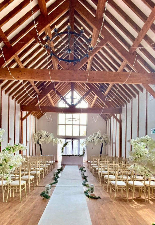 Ceremony with white carpet vaulted ceiling