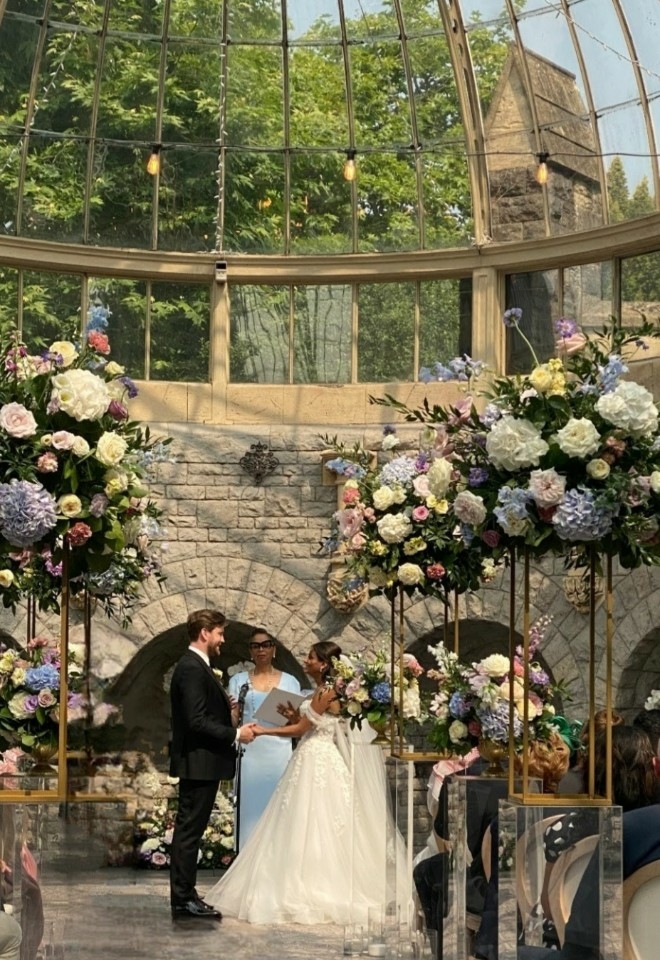Jennifer Patrice, an experienced Independent Celebrant, with a happy couple on their wedding day, delivering an authentic, joyful, and personalised ceremony in a beautiful setting.