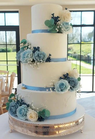 White Wedding Cake with Blue & White Sugar Roses & Foliage