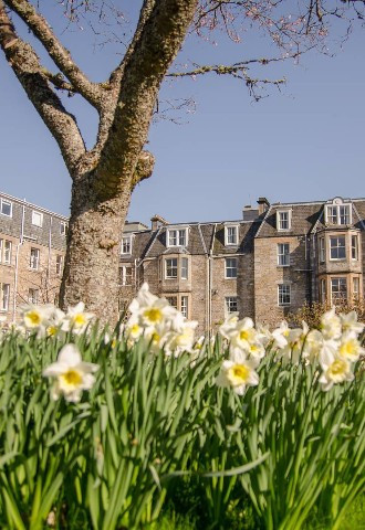 Exterior building and gardens with flowers at The Fishers Hotel Wedding Venue