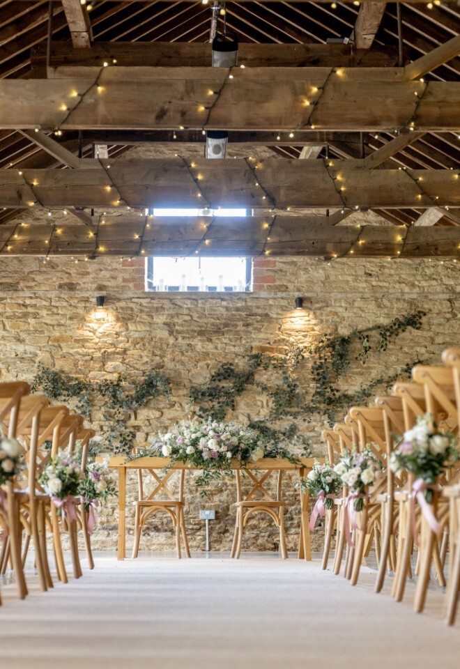One of the barns used for an aisle for a couple at an Oxfordshire wedding venue
