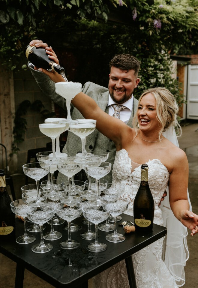 Smiling couple pouring a champagne 