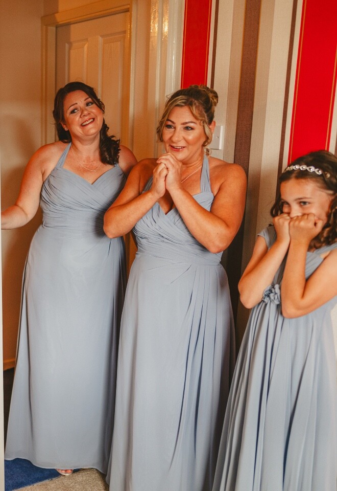 Emotional bridesmaid reactions during bridal preparations