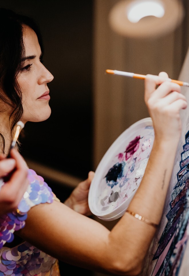 guest painting at wedding