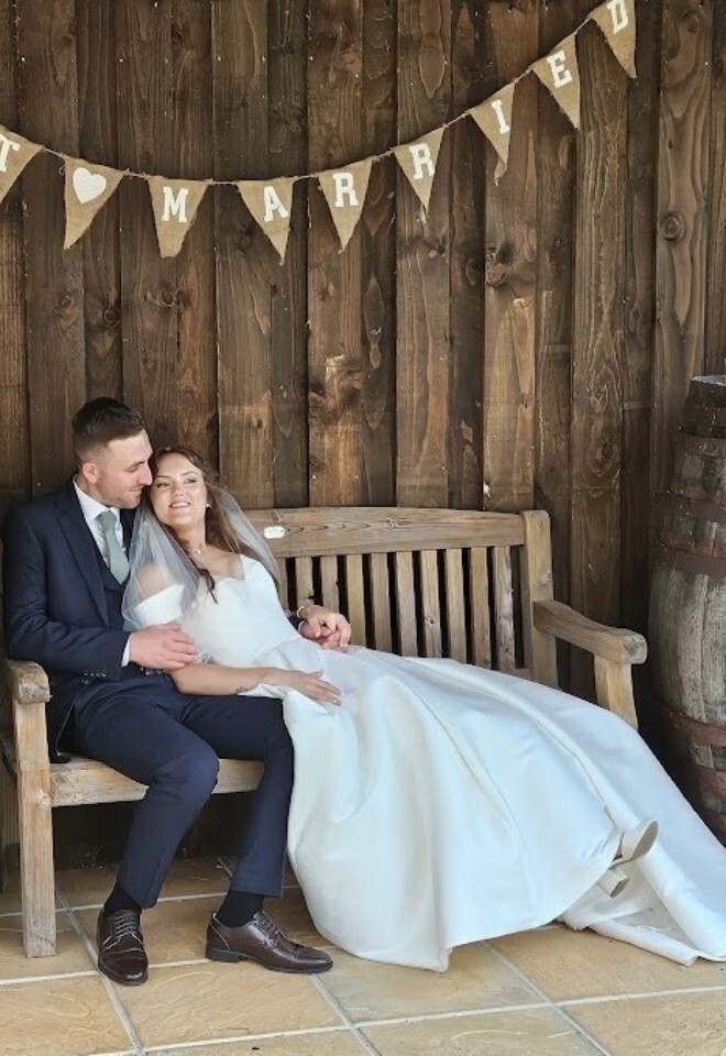 Couple Relaxing at Yarlington Barn after their wedding ceremony