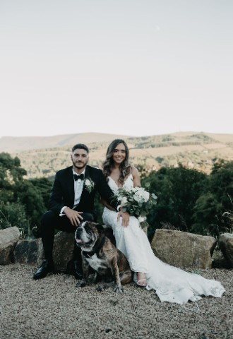 Wedding couple photo with dog at The Stables Wedding Farm