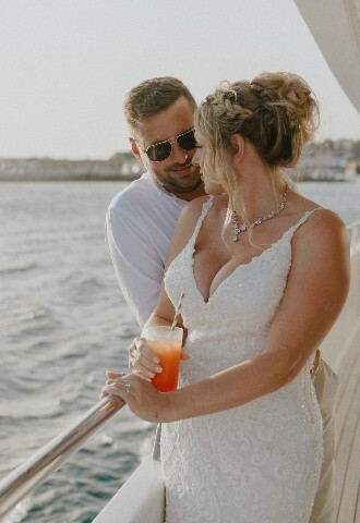 Bride and groom share an intimate moment at their yacht wedding reception in cyprus