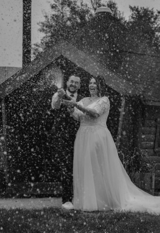 Champagne spray wedding couple