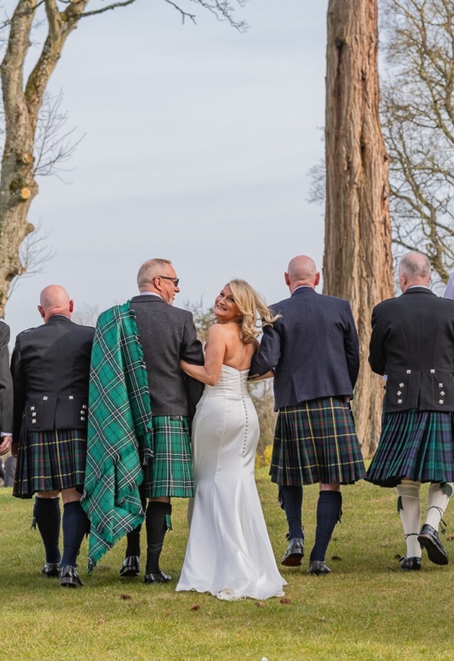 bride with groom & groomsmen in kilts for Scottish wedding in Aberdeen