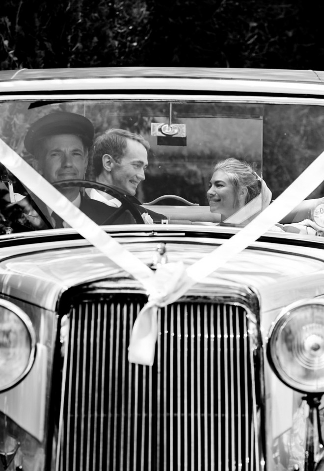 black and white wedding couple in car taken by caroline rushton