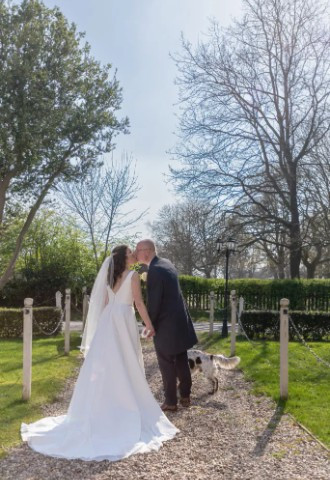 Bride and groom with their dog after their wedding ceremony at The Charlecote Pheasant Hotel