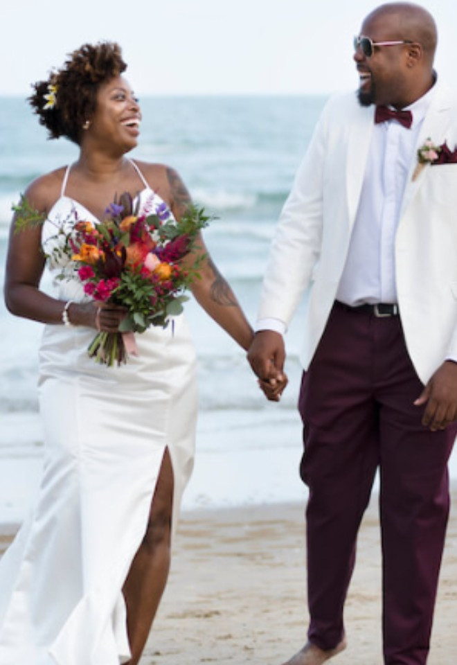 image shows destination wedding ceremony on a beach