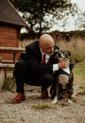 Groom with wedding dog