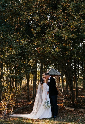 bride and groom in wedding woodland at Stratton Court Barn