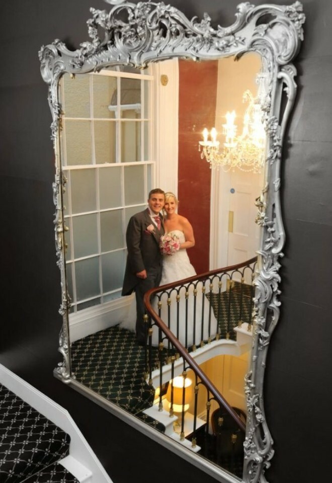 Couple on staircase mirror