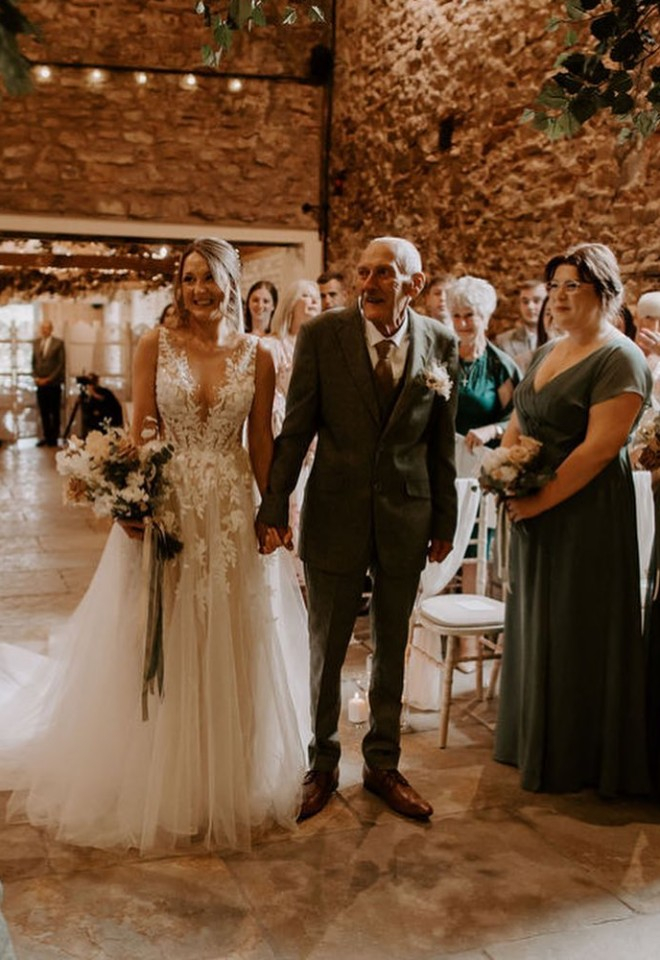 Brides grandfather walking her down the isle to get married at Eden Wedding Barn cumbria
