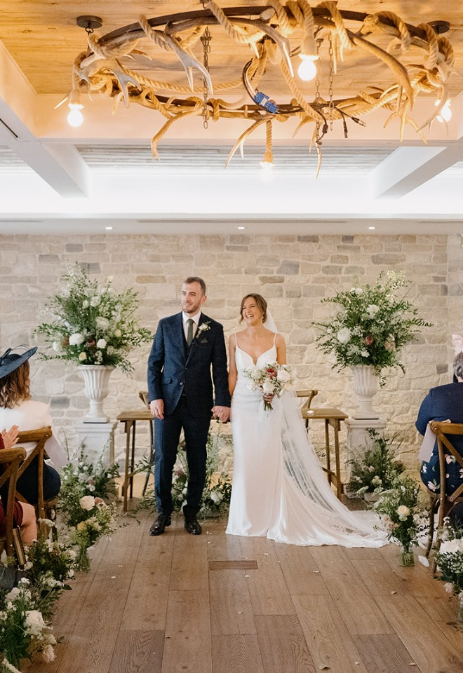 Bride and groom at alter in Wild Thyme & Honey