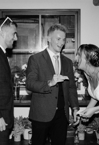 Bride and groom laugh at trick Ben Smith has performed