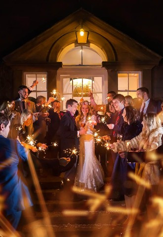 wedding reception sparkling photo at Charlton Hall with bride , groom and their wedding party