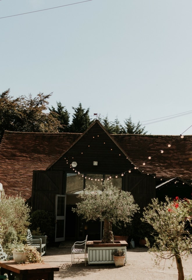 Barn, marquee and courtyard area at Monkton Barn wedding venue in Buckinghamshire