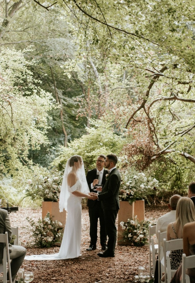 Woodland wedding ceremony at Monkton Barn in their private Woodland Dell