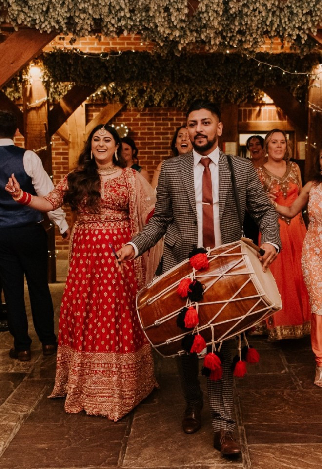 Indian bride in sari celebrates her cultural wedding with traditional music