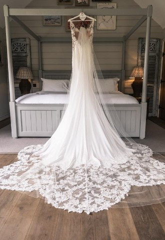 Wedding dress hanging in bridal suite