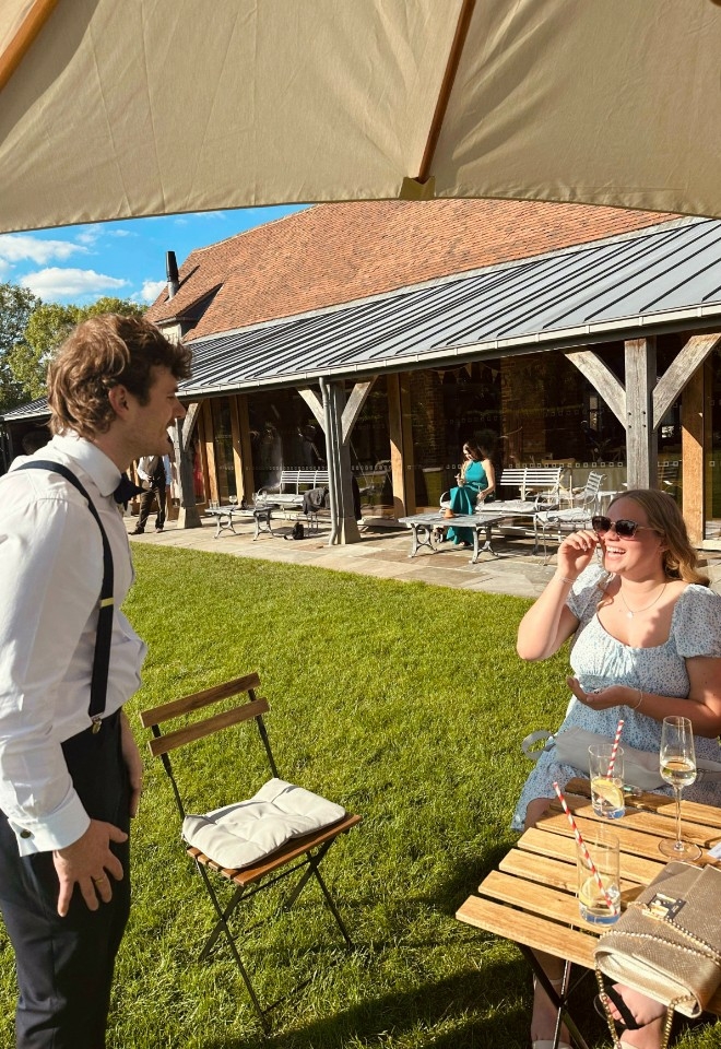 Nicky George performing magic at a wedding