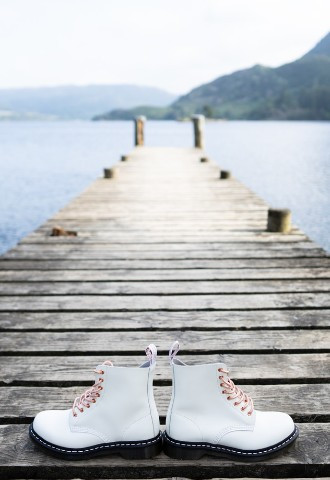 Shoes left on bridge at lake