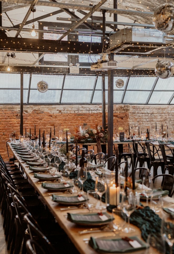The workshop with cosy dark green décor and disco balls. 